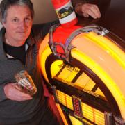 Philip Dingle, owner of Mr D's Diner near Attleborough with the jukebox which has raised £3000 for charity.Picture by: Sonya Duncan