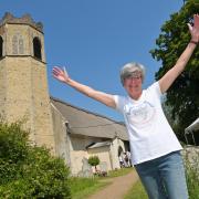 All Saints Church in Old Buckenham has been taken off Historic England's 'at risk' register following the completion of the Raise the Roof project. Pictured is its project lead, Alison Hannah