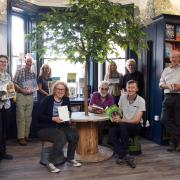 Tracy Kenny, front centre left, director and co-founder, with the Kett's Books team at their new Market Place home in Wymondham