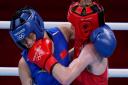 Britain's Charley-Sian Davison, right, exchanges punches with China's Chang Yuan during their women's flyweight 51-kg boxing match at the 2020 Summer Olympics, Thursday, July 29, 2021, in Tokyo, Japan.