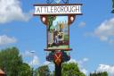 A town sign in Attleborough showing cider making. Cider making was an important part of Attleborough's economy for almost 100 years. Picture: DR ANDREW TULLETT