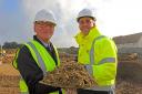 Philip Edge (left), chairman of Harling Parish Council, and Paul LeGrice, managing director of Abel Homes, cut the first sod at the site of 85 new homes at East Harling