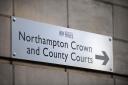 A sign pointing the way to Northampton Crown and County Courts (Tony Marshall/PA)