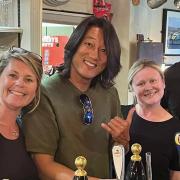 Sung Kang with staff at the Bird in Hand in Wreningham.