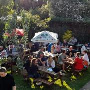 People enjoying a drink in the Green Dragon's beer garden