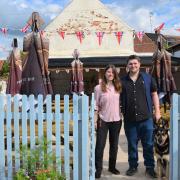 Landlady and landlord Kayleigh Charlish and Kieran Bullen with dog Nova in the new garden at The White Hart in Wymondham.