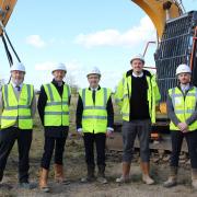 James Francis, CEO of Saffron Housing Trust, with construction manager Mark Gosling, regional managing director Simon Medler, assistant contracts manager Kyle Farr and James Sutton, site manager at Lovell at the former home of Wymondham Rugby Club