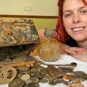 Jennie Fitzgerald, from Sprowston, with the treasure chest, and its contents, that she found on a North Norfolk beach. Picture: Lauren De Boise