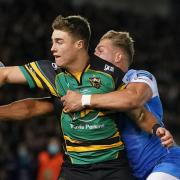 Tommy Freeman, left, in action for Northampton Saints. The former Wymondham player is in the England squad for the Autumn International series