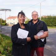 Resident David Bell, pictured with concerned parish councillor, Sara Harrold. Mr Bell has collected 178 signatures on a petition calling for tighter speed limits and road markings at the crossroads in Barnham Broom. Picture: DENISE BRADLEY