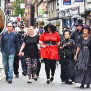 The funeral procession for Peter Green goes through Wymondham town centre with many of his friends and family dressed in steam punk clothes in his memory.