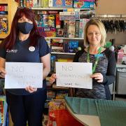 Lorraine Curston (right), founder of Sprowston-based Dawn's New Horizon, in its charity shop on Cannerby Lane, with Christina Martin, a community champion for the domestic abuse support group from Harford Bridge Tesco store.