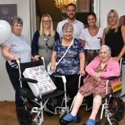 Daphne Goddard took up colouring with her left hand after a stroke made her unable to use her right side. Pictured, from left, are her daughter Angie Carr, Carleton House manager Deana Burton, daughter Debbie Winter, director Ben Jourdan, administrator