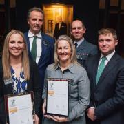 Breckland leader, Sam Chapman-Allen, and chief executive, Maxine O\'Mahony, picking up the gold award from the Ministry of Defence