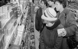 Customers looking at christmas confectionery at Woolworths in Wymondham, 3 December 1981. Photo: Archant Library